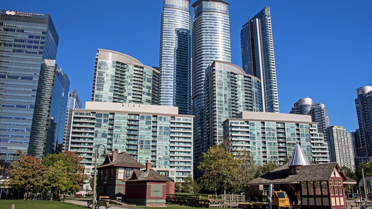 Skyscrapers and condominiums in downtown Toronto with the Rail Museum in the foreground.