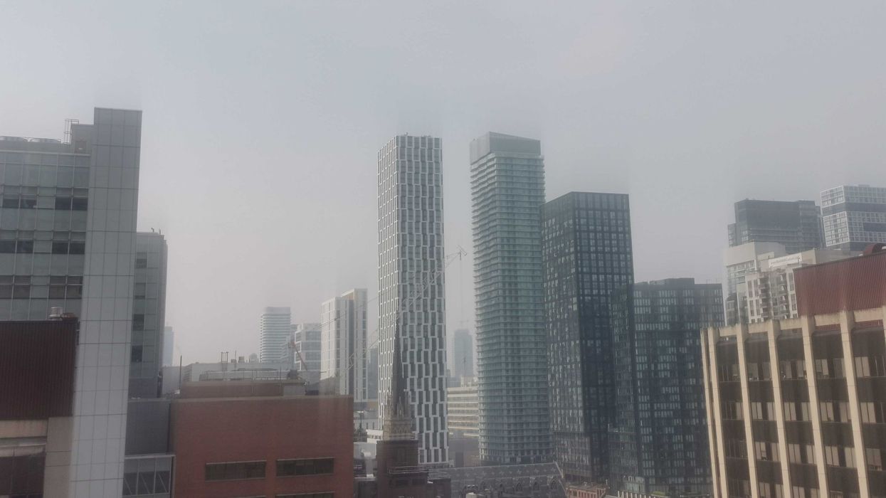 smoky sky above buildings in toronto on june 5, 2025