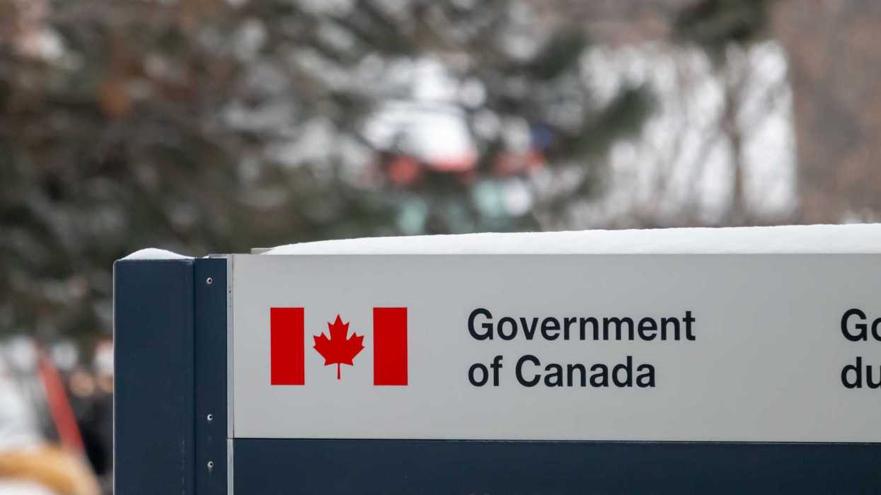 snow covered government of canada sign