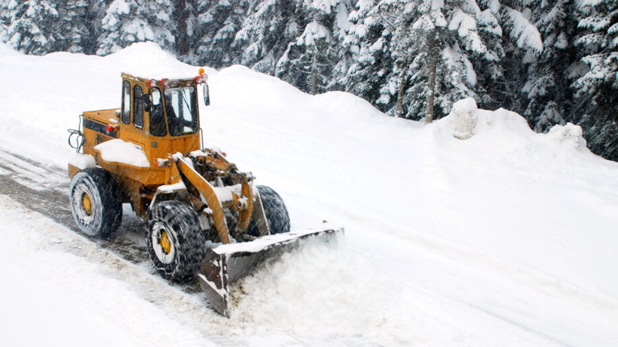 Snowplow clearing a street.
