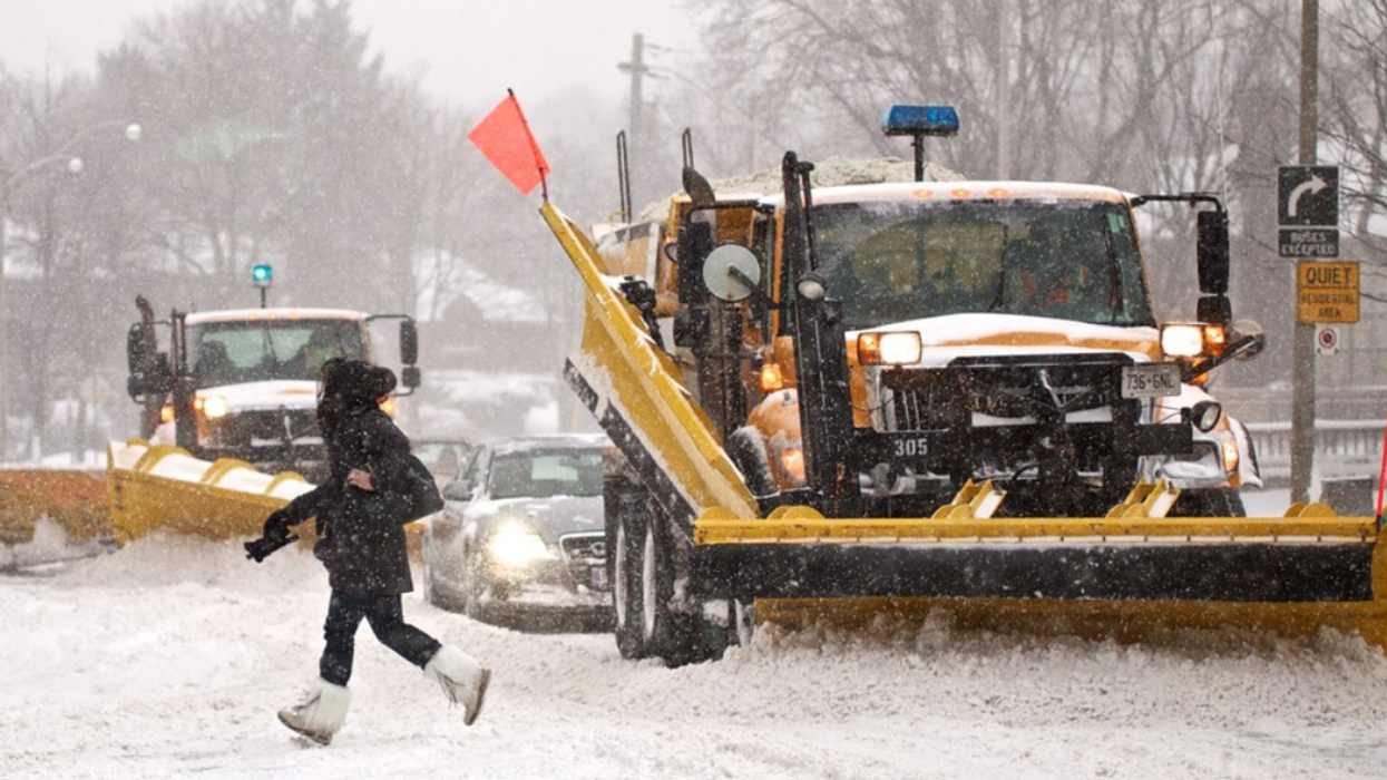Snowy road being plowed in Ontario.