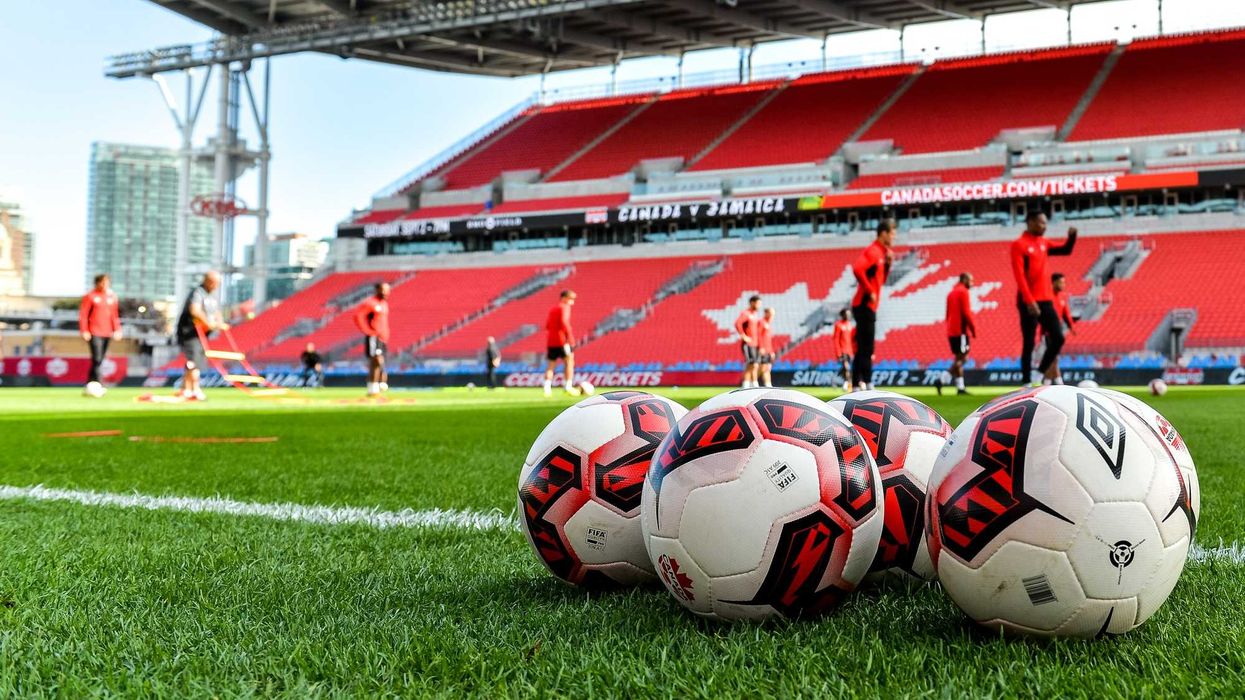 soccer balls on turf as canada men's nationa team players train at bmo field in toronto