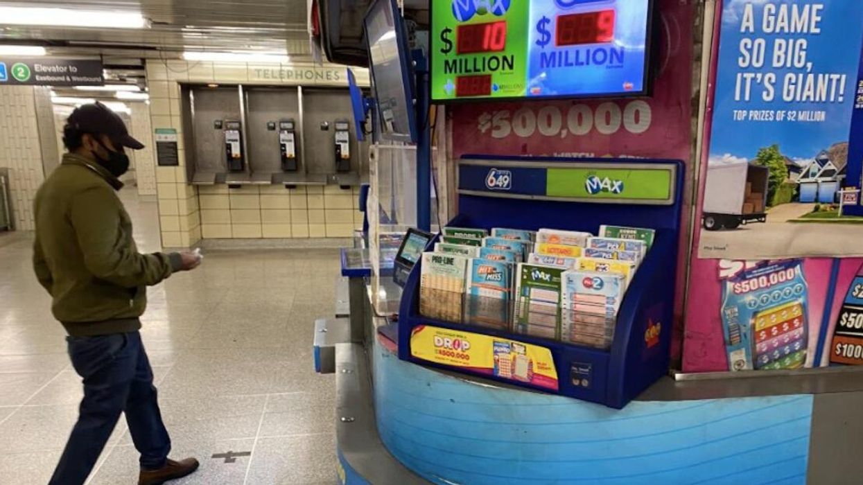 Someone buying a lottery ticket in Toronto