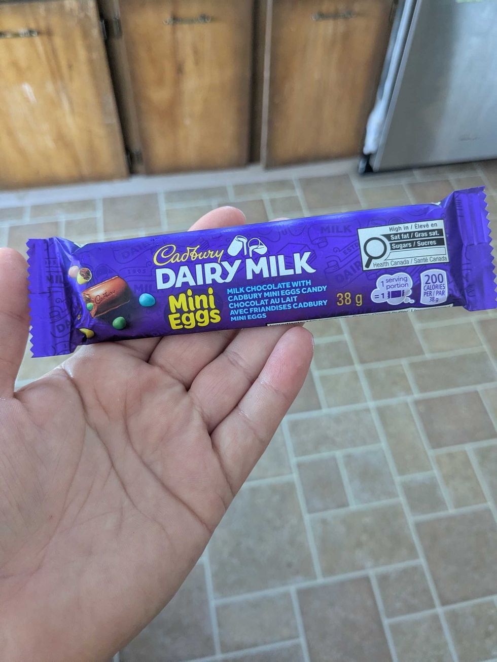 Someone holding a Cadbury chocolate bar