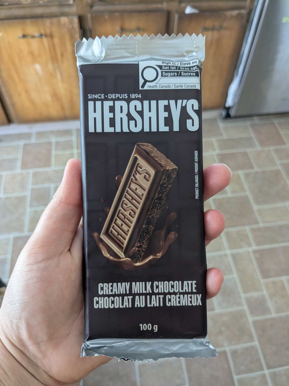Someone holding a Hershey's chocolate bar