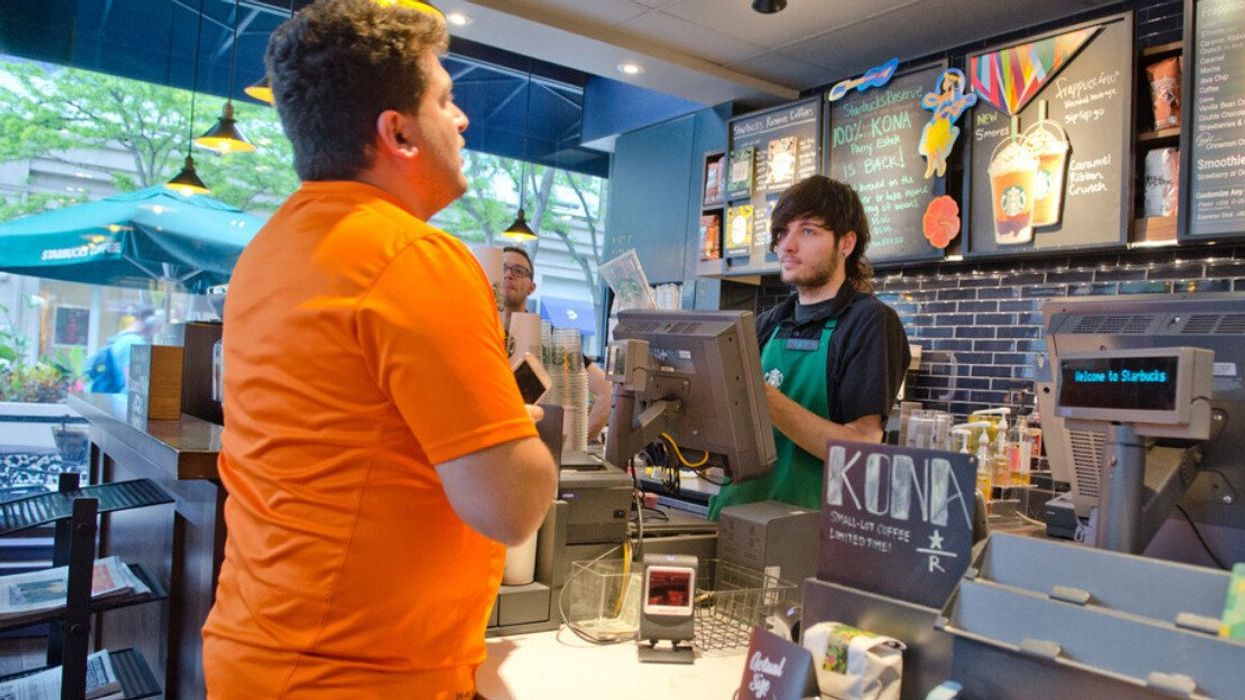 Someone ordering at a Starbucks.