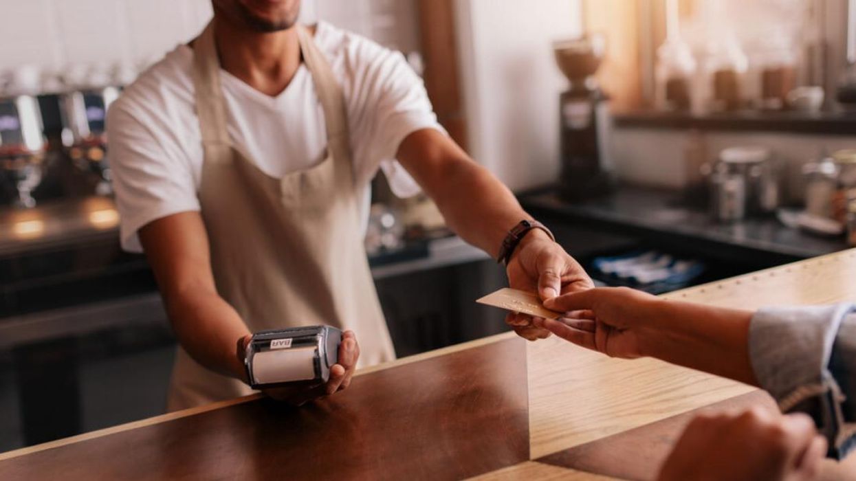 Someone paying in a restaurant.