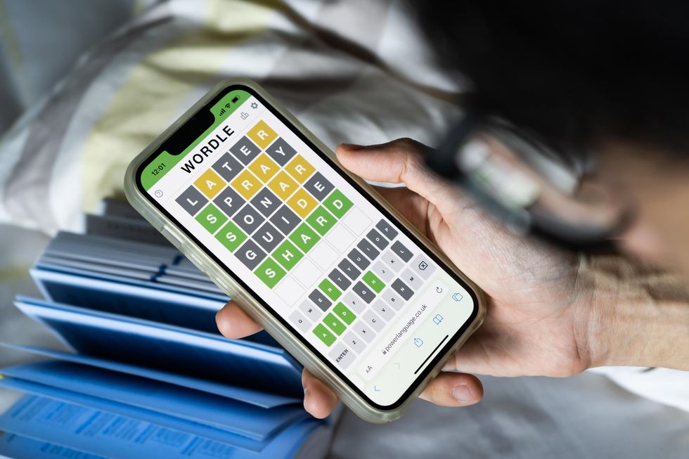 Someone playing Wordle on their phone.