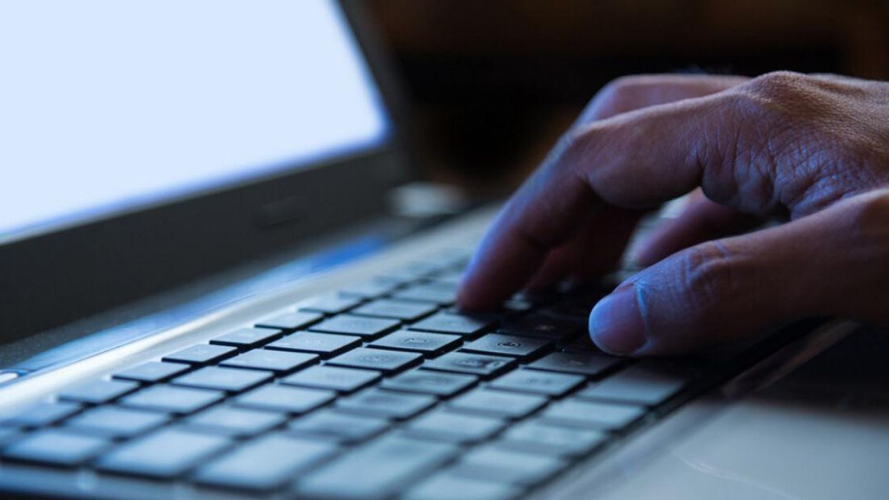 Someone typing on a computer.