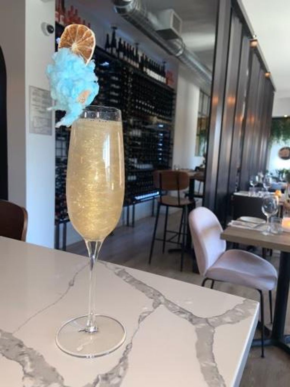 Sparkly glitter Prosecco with cotton candy garnish.
