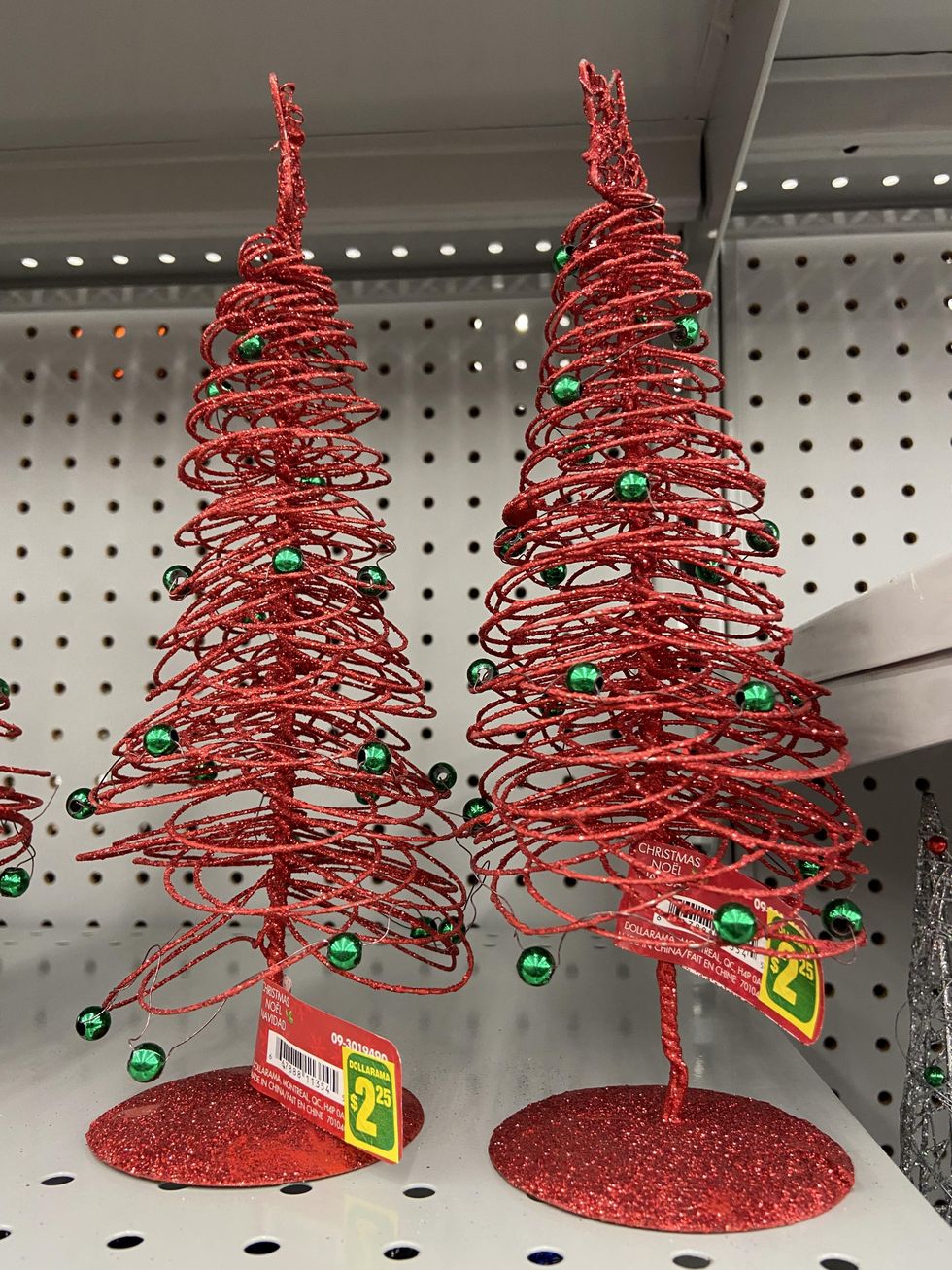Sparkly red mini Christmas trees with green bulbs.