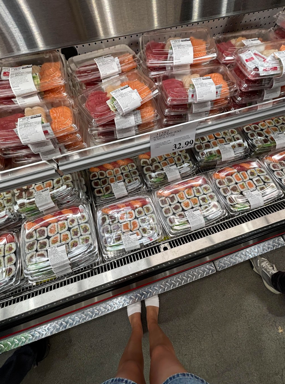 Sshi at a store.