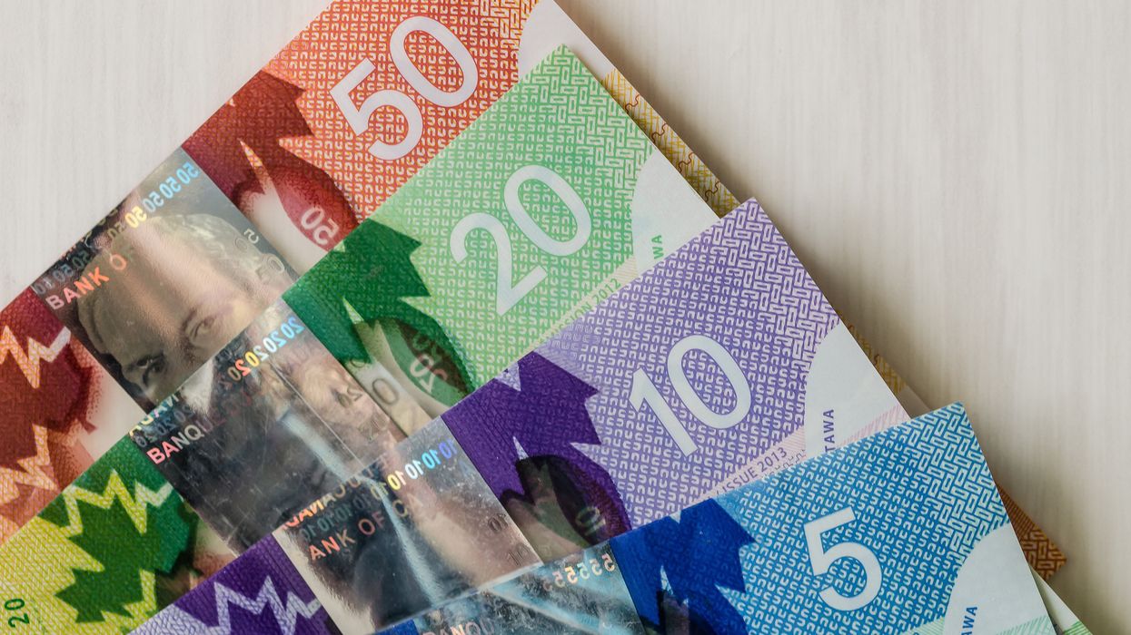 Stack of Canadian money including $50, $20, $10 and $5 bills.