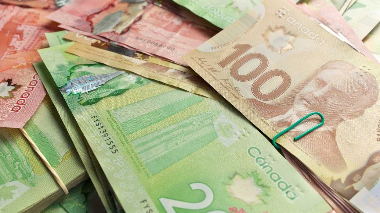 stacks of canadian $100, $20 and $50 bills