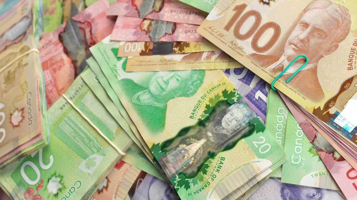 stacks of canadian $100, $20 and $50 bills