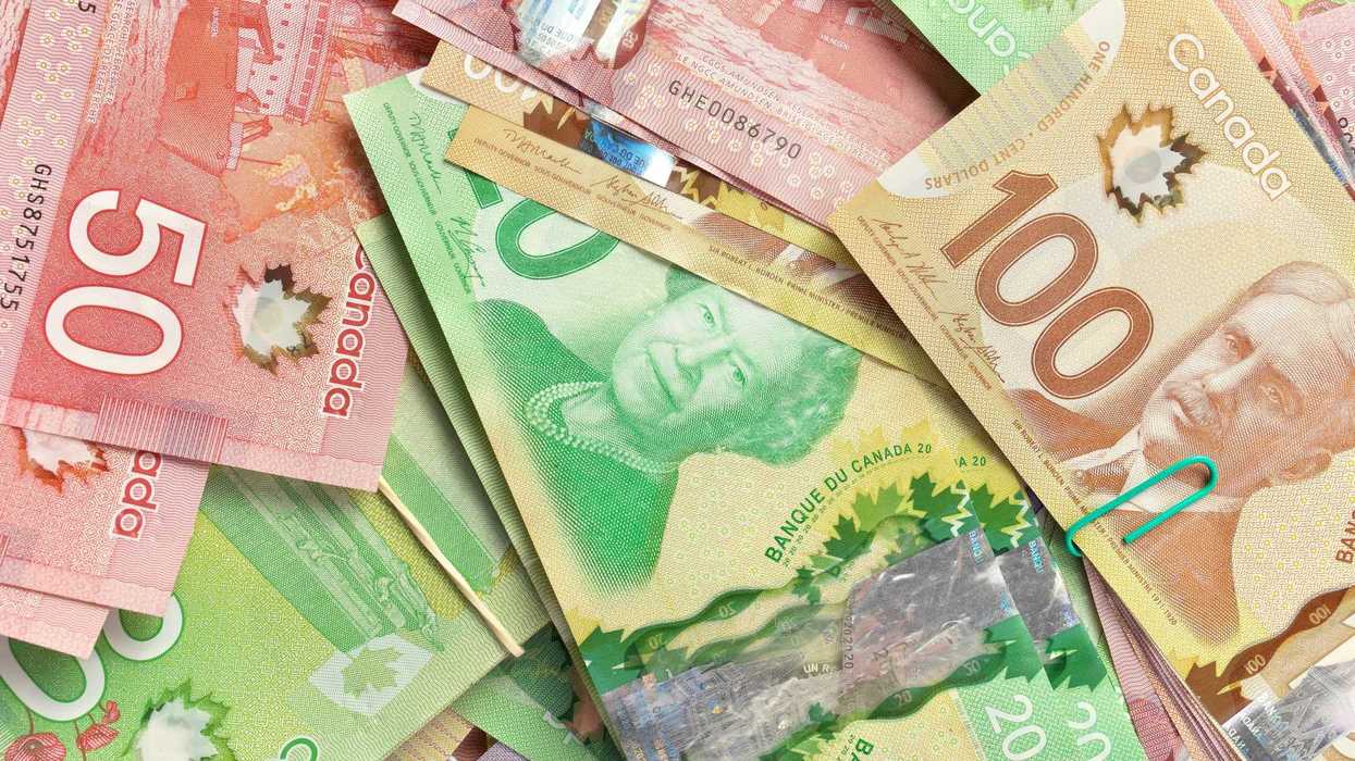stacks of canadian $100, $50 and $20 banknotes