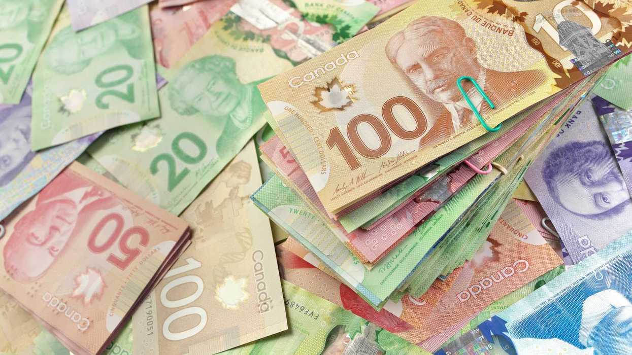 stacks of canadian $100, $50 and $20 bills
