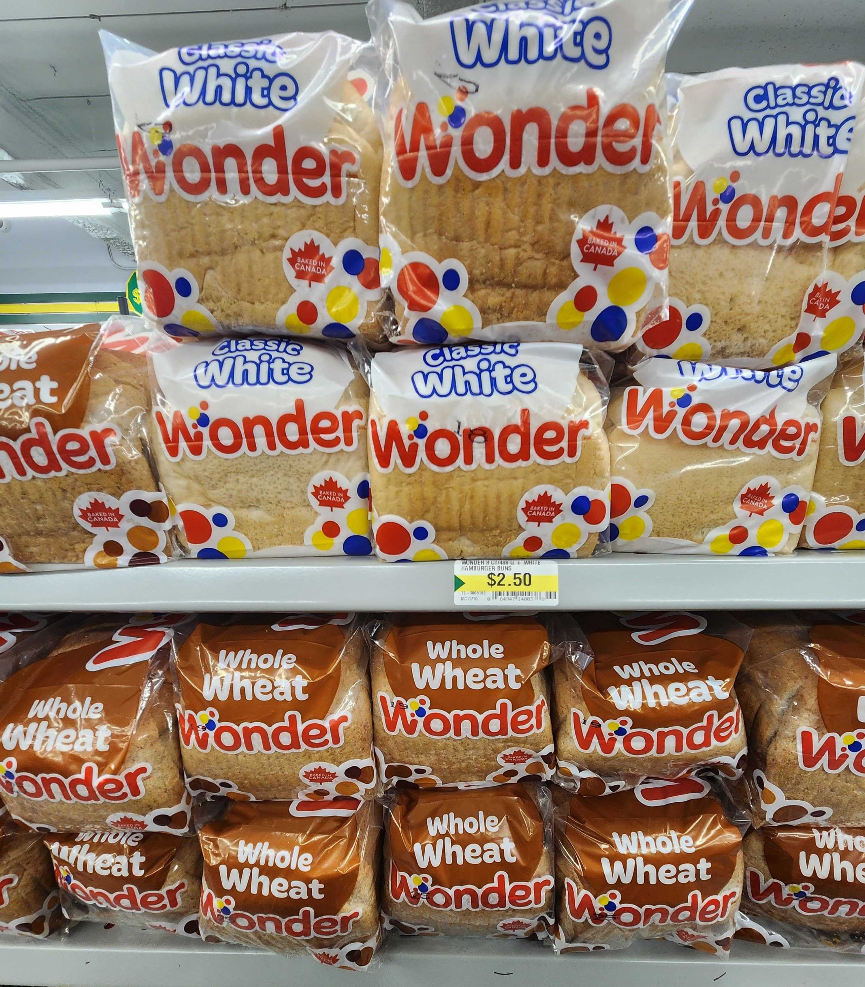 Stacks of Classic White and Whole Wheat Wonder Bread.