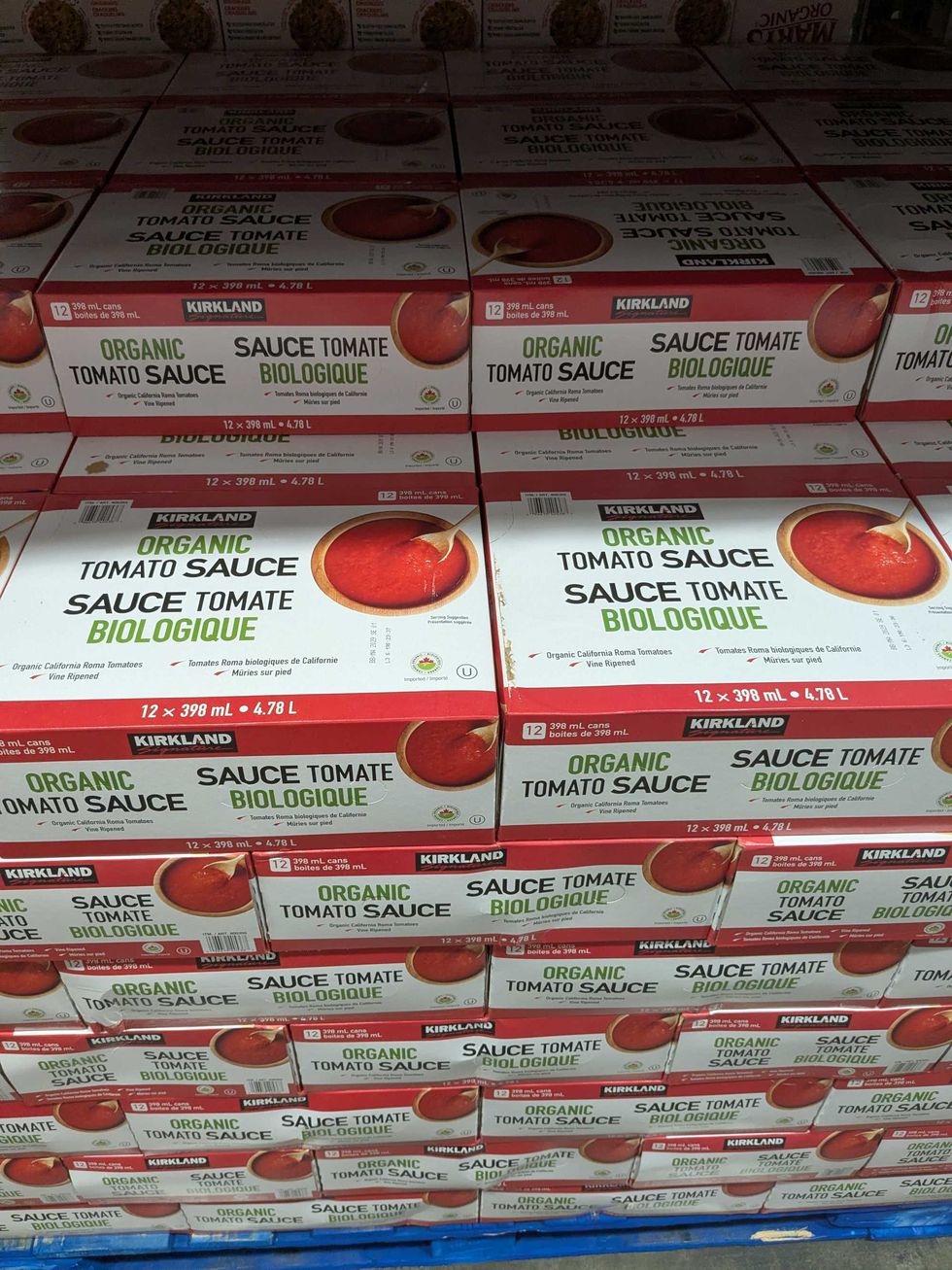 Stacks of tomato sauce on a pallet at Costco