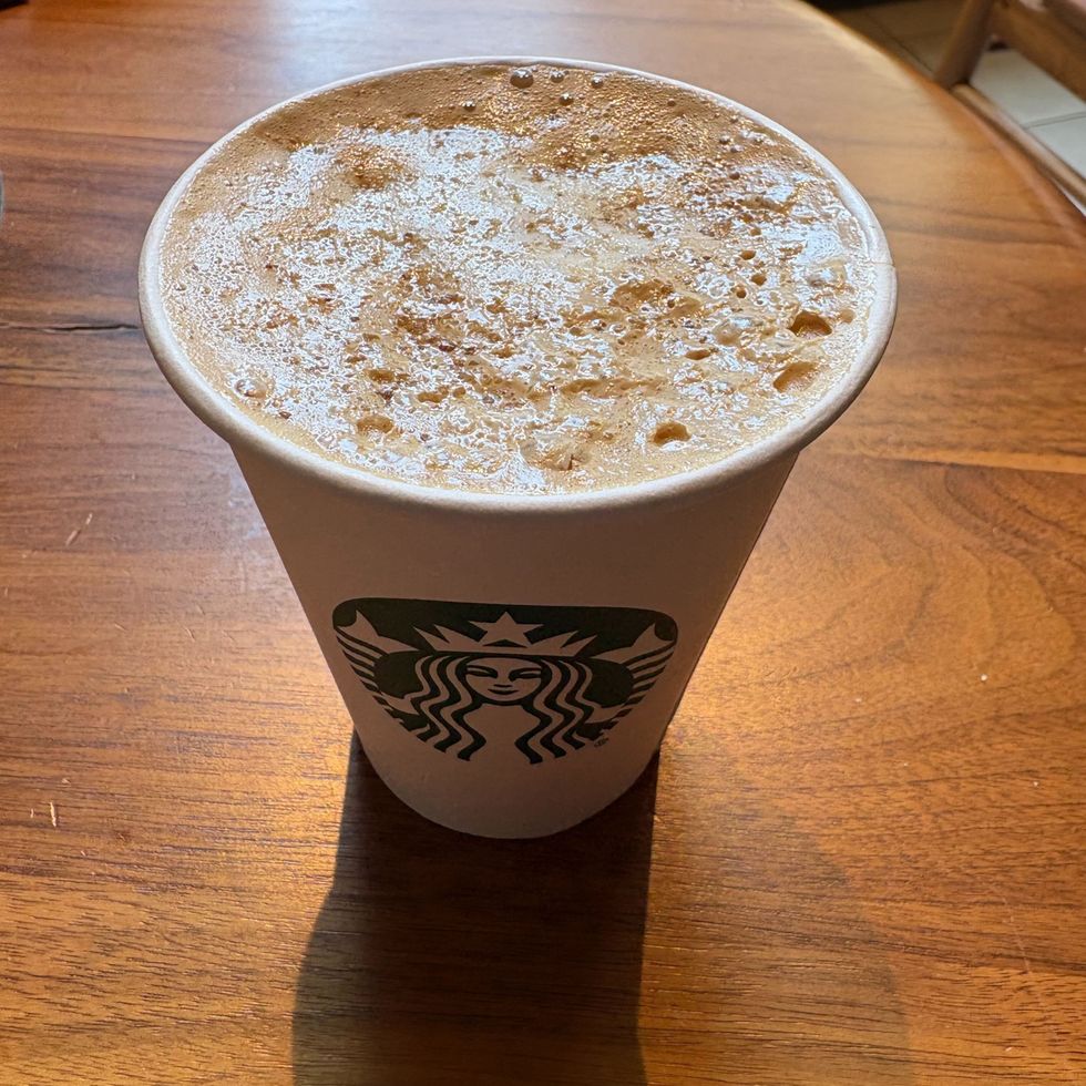 starbucks pecan oat cortado on a wooden table