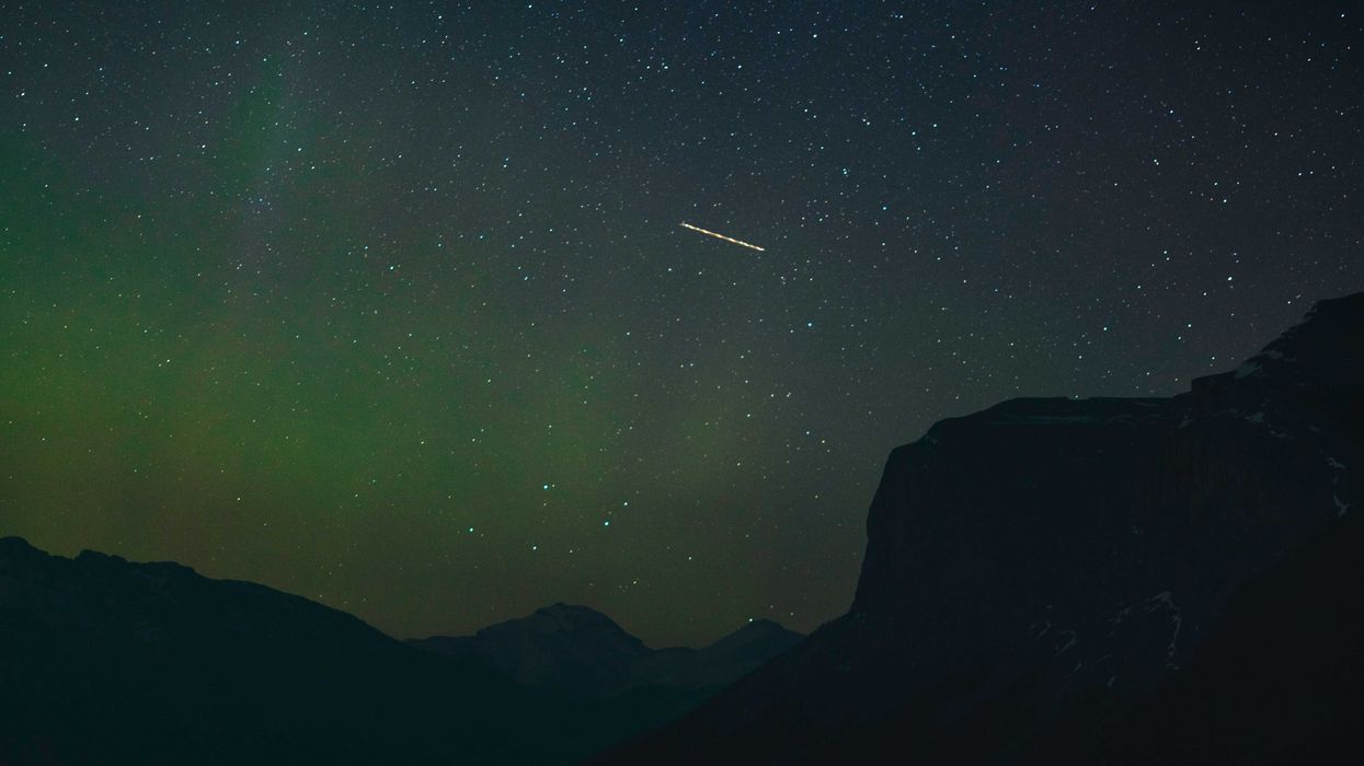 starry night sky over mountains in alberta canada