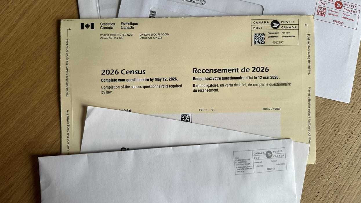statistics canada census package with other mail on a table
