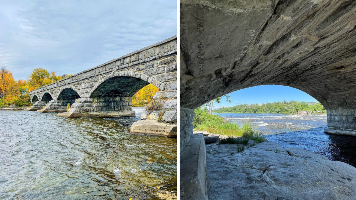 Stone arches of the Pakenham five span bridge over river rapids in Ontario.