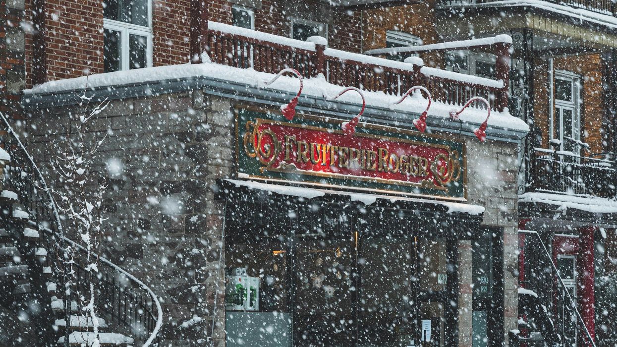 storm covering a city street with snow in canada