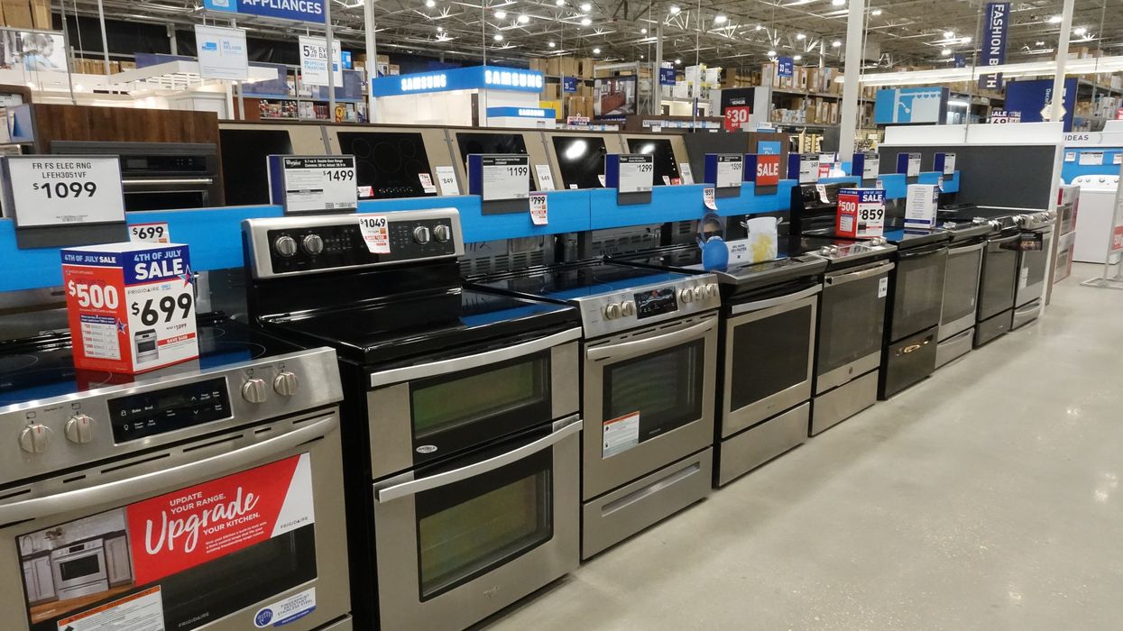 Stoves for sale in a Lowe's store (illustrative).