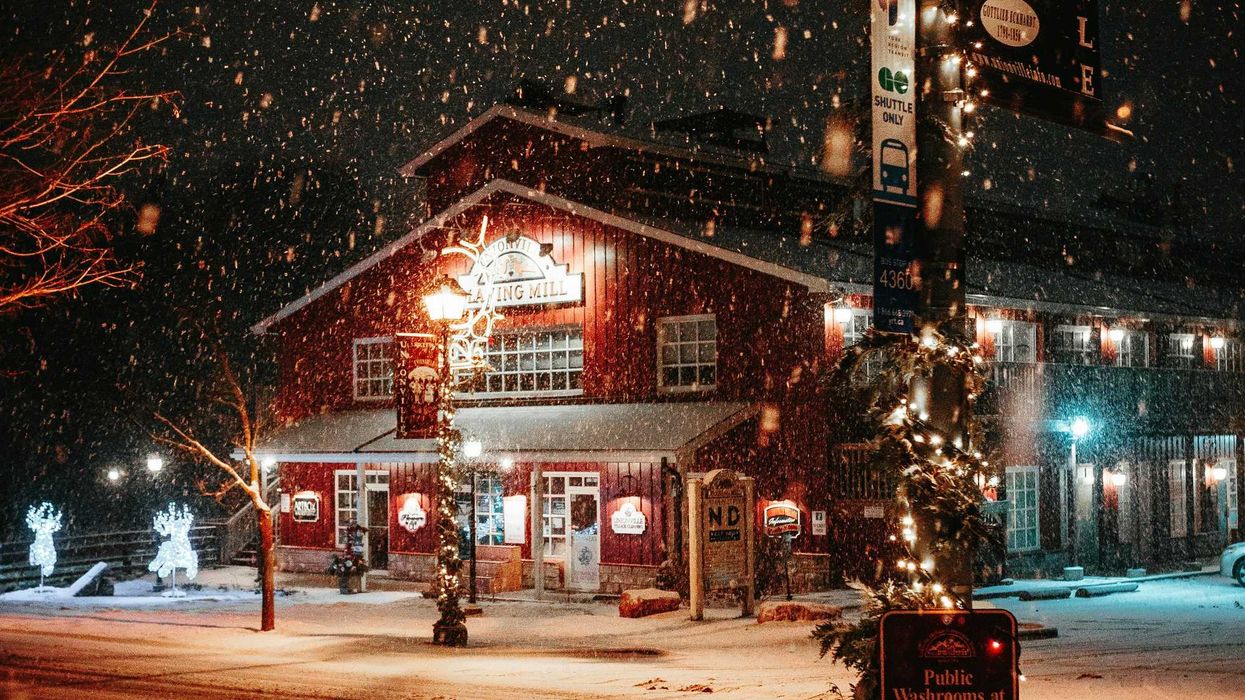 street in unionville ontario decorated for christmas while it snows