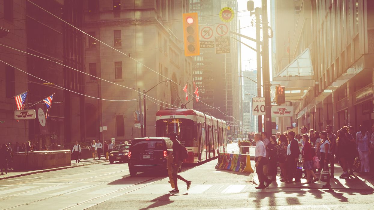 Sunset in Toronto on a busy street.