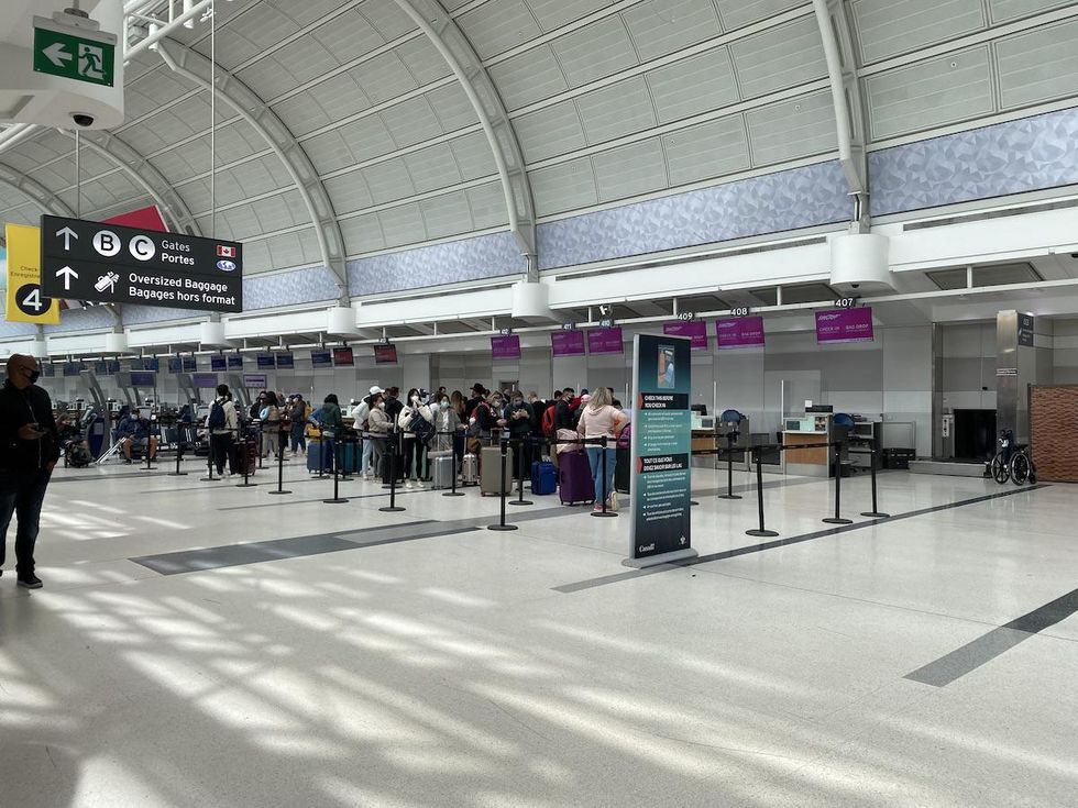 swoop check-in line at Pearson Airport in Toronto