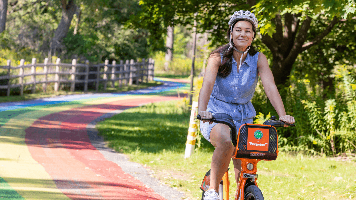 Tangerine bike share rider