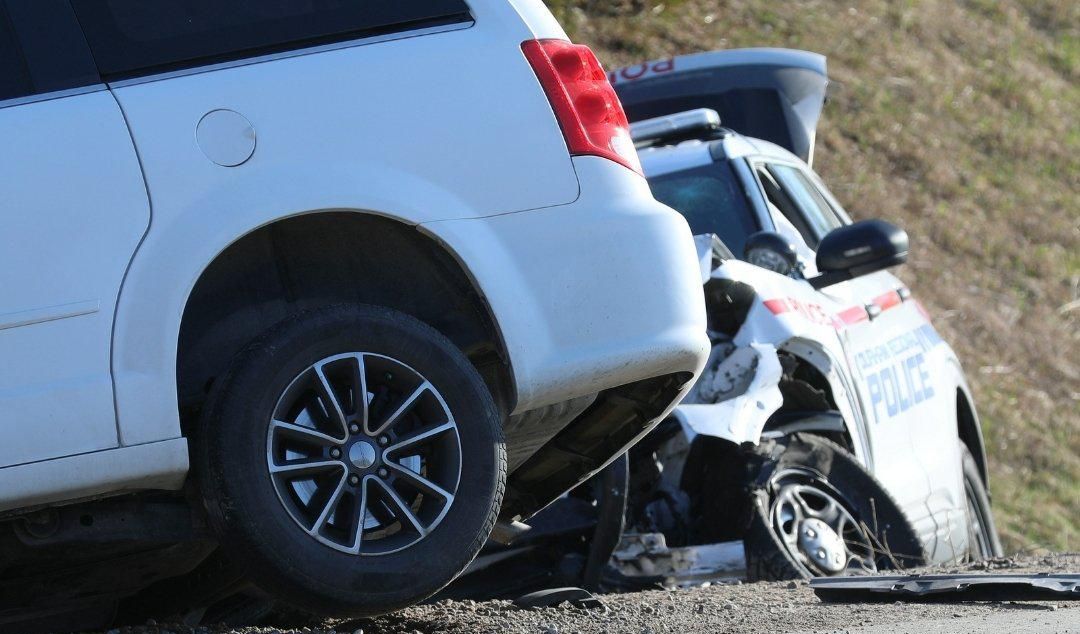 The aftermath of a collision involving a police vehicle.