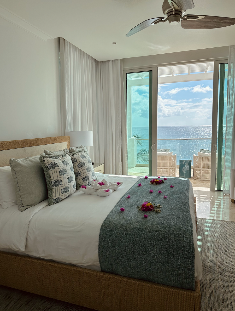 The airy, relaxed bedroom in one of Windjammer Landing's hillside villas.