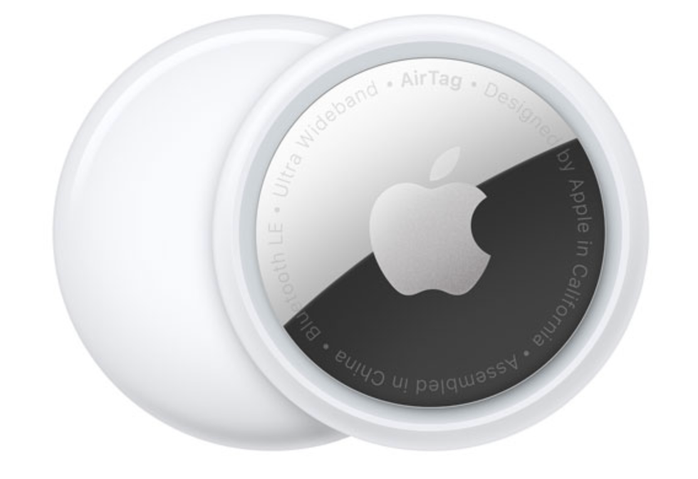 The back and front of a white Apple AirTag.