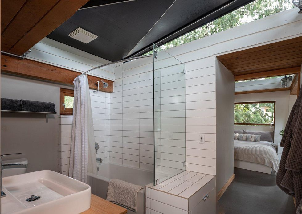 The bedroom and bathroom at the property.