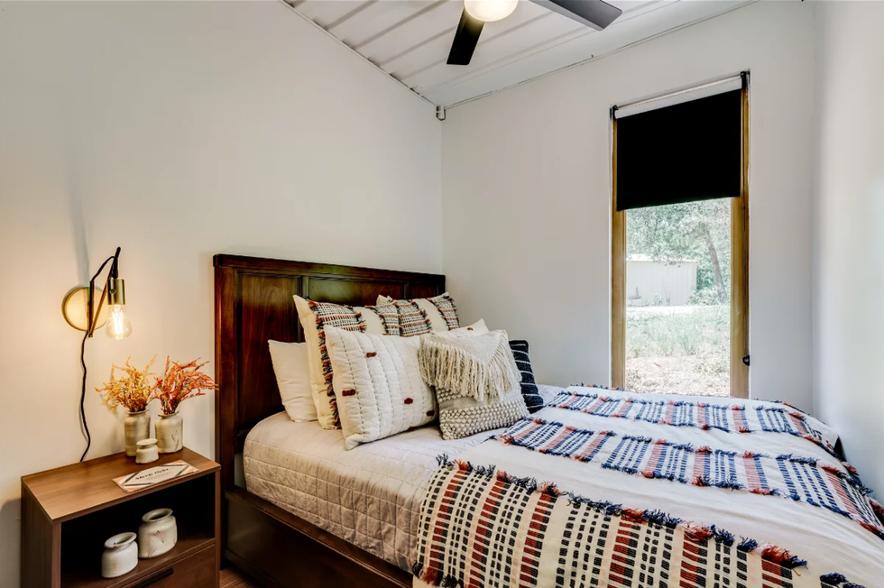 The bedroom in the tiny home for sale.