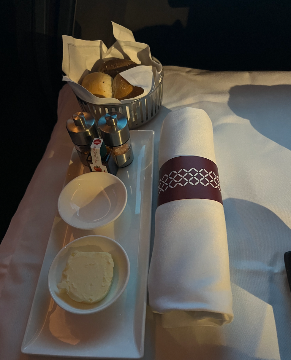 The bread basket, butter and balsamic red chilli oil served to me on Qatar Airways business class.