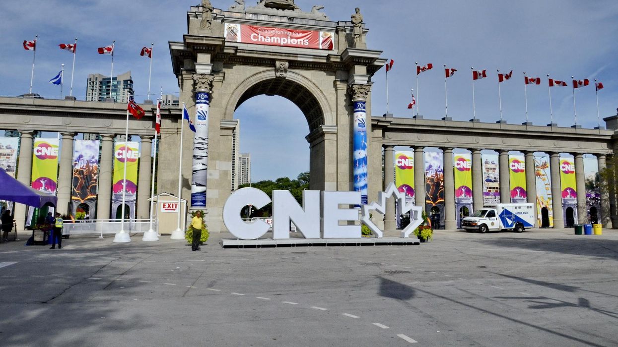 The CNE logo in front of The Princes' Gates in Toronto.