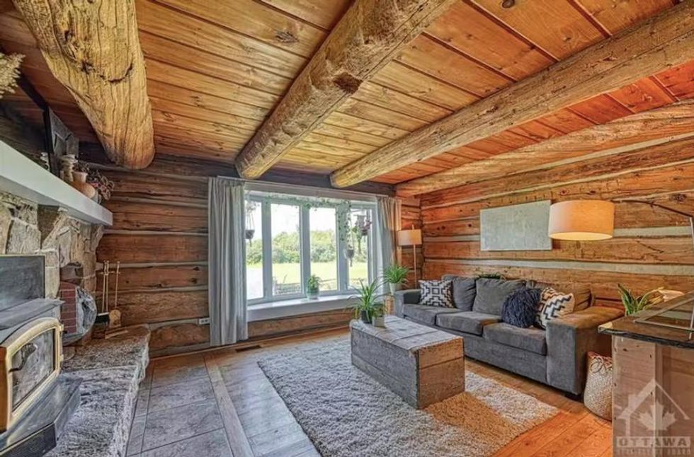 The cozy living area inside 76 Crystal Road, Jasper, ON.