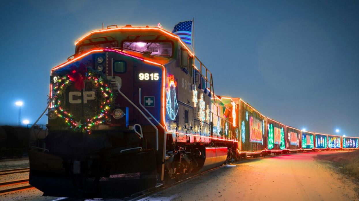 The CP Holiday Train covered in lights and decorations.