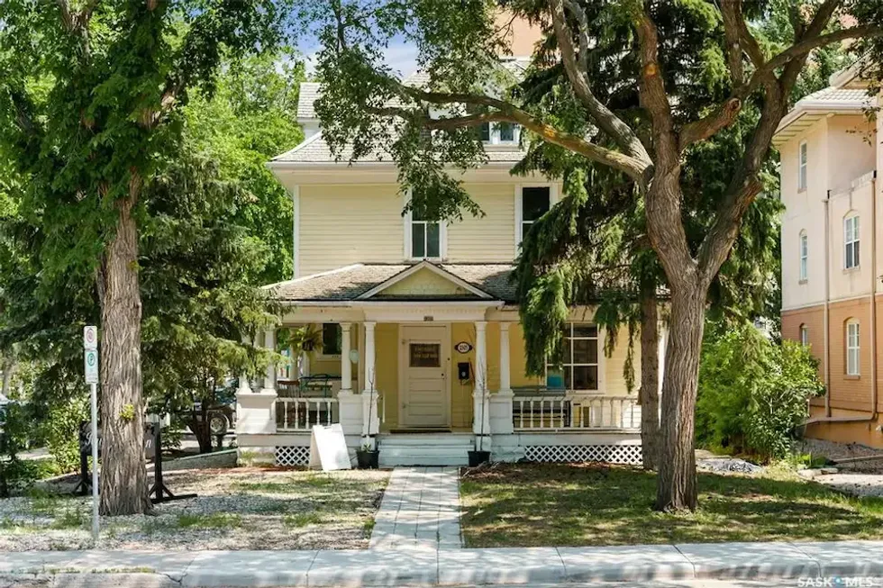 The exterior of the yellow home