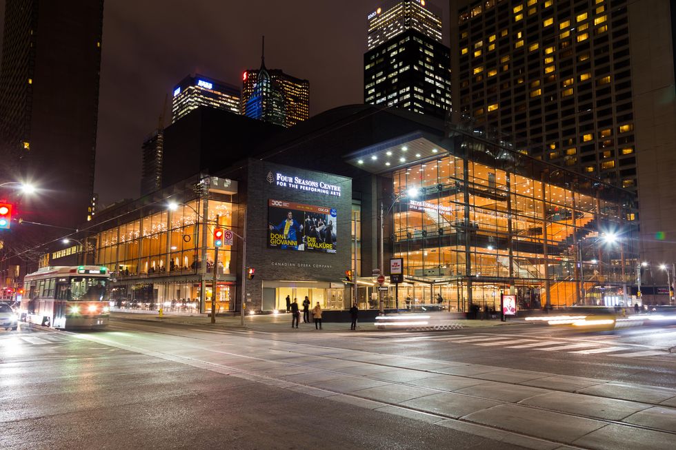 The Four Seasons Centre for the Performing Arts lit up at night.