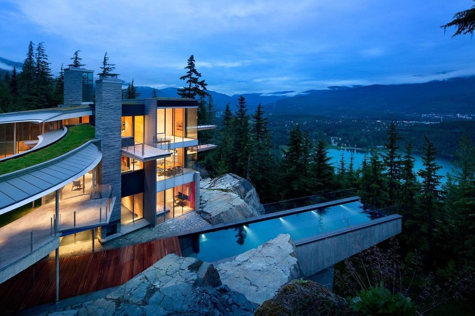 The glass and rock house overlooking Alta Lake in Whistler.