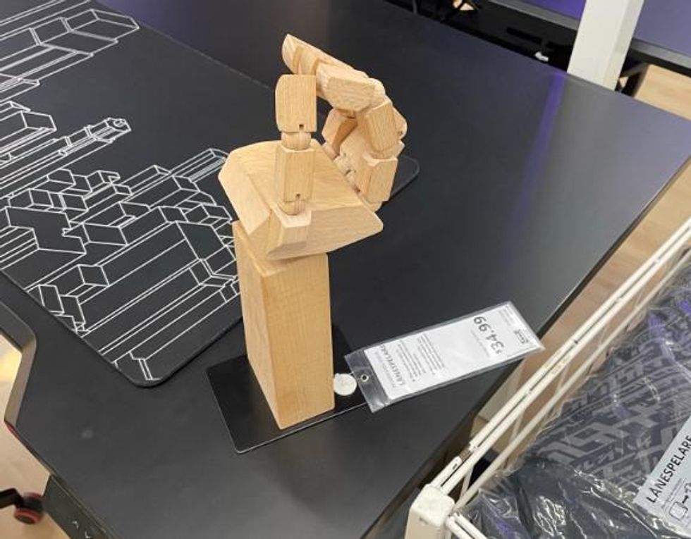 The hand-shaped L\u00c5NESPELARE accessory stand.