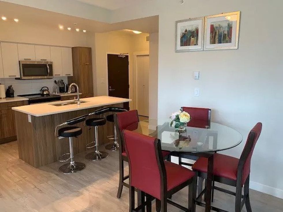 The kitchen and front entrance of an apartment for rent in Edmonton, AB.