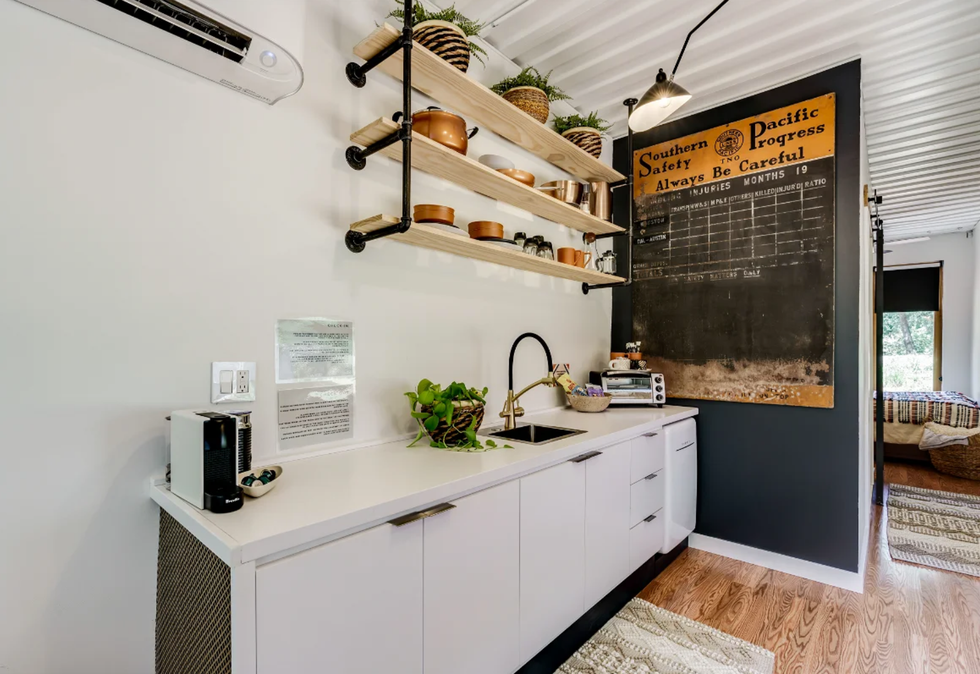 The kitchenette inside the renovated shipping container for sale in Keller, TX.