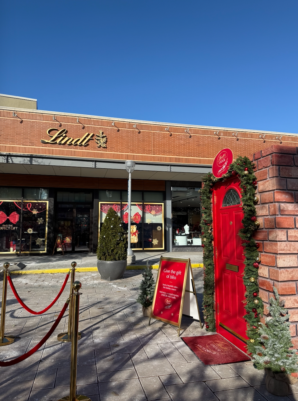 The LINDOR Red Door outside the Lindt Chocolate Shop at CF Shops at Don Mills.