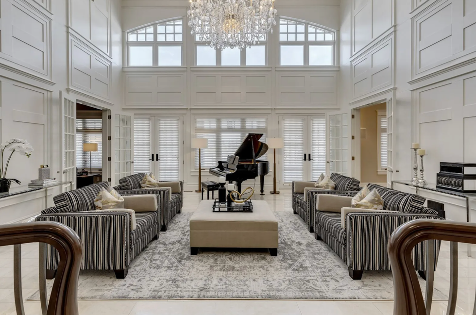 The living room with a Swarovski crystal chandelier.